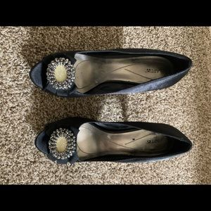 Black satin formal pumps